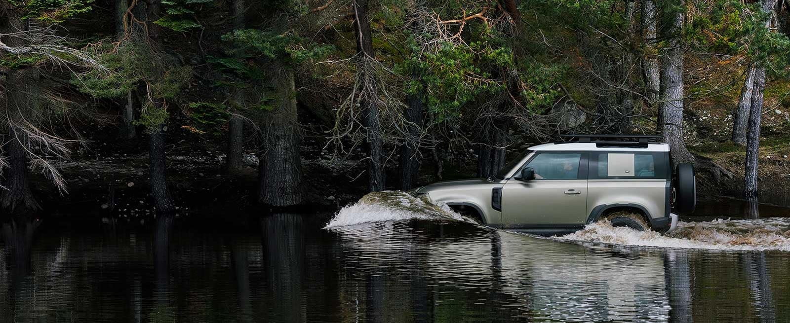 New Defender 90 Wading Through Woodland River