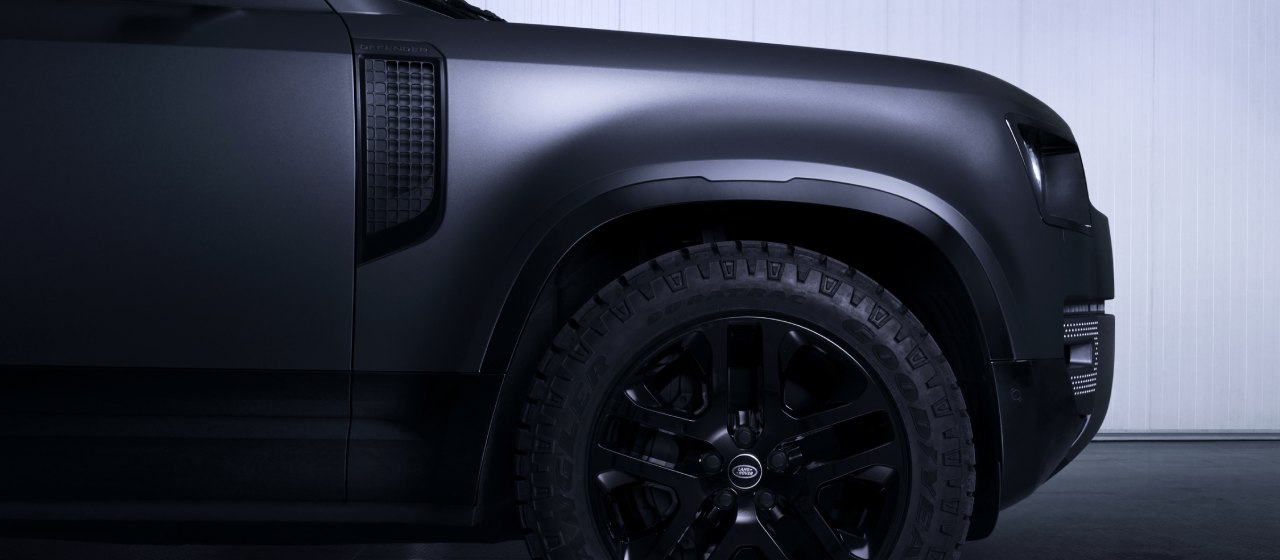 Black Land Rover Defender Side